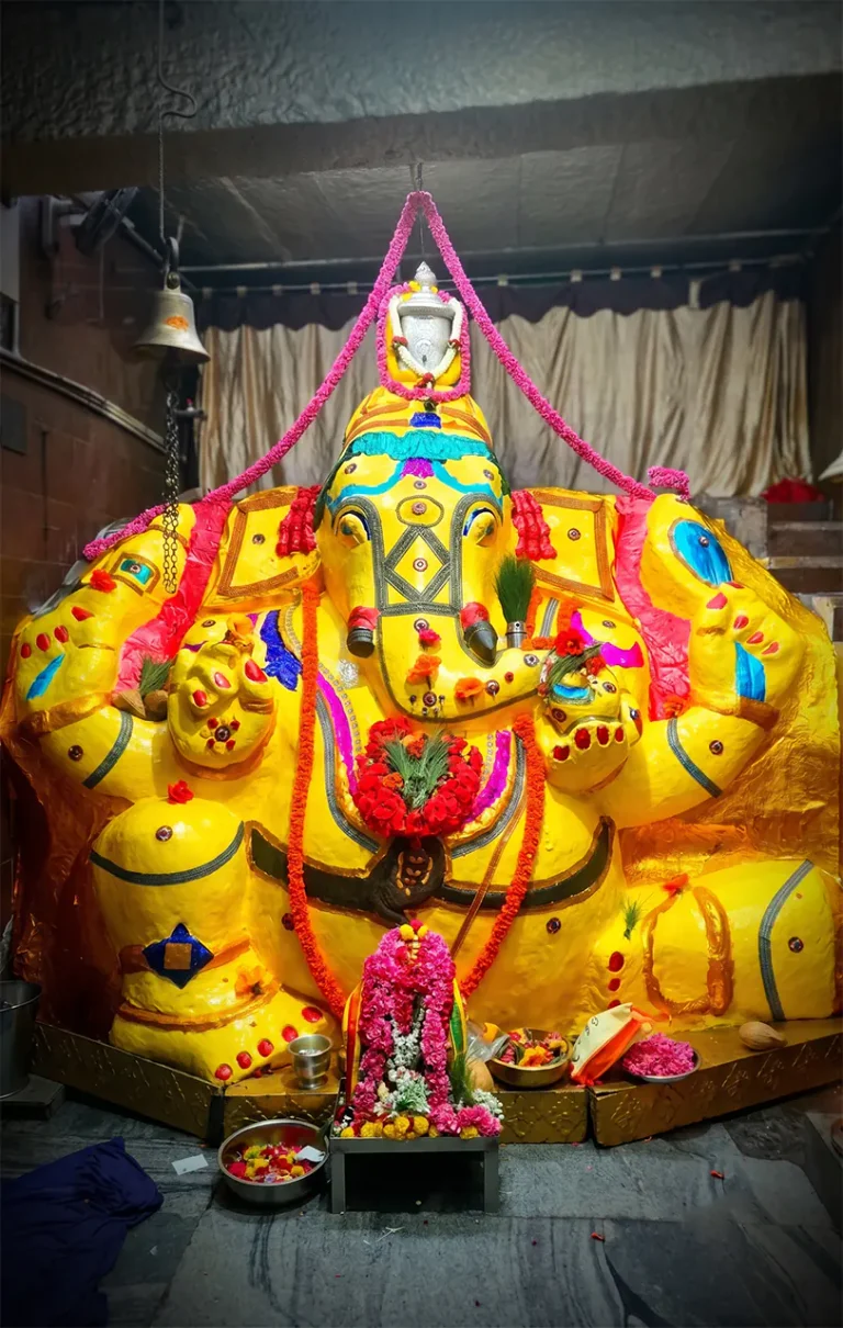 Dodda Ganapathi decorated with yellow colour and flowers