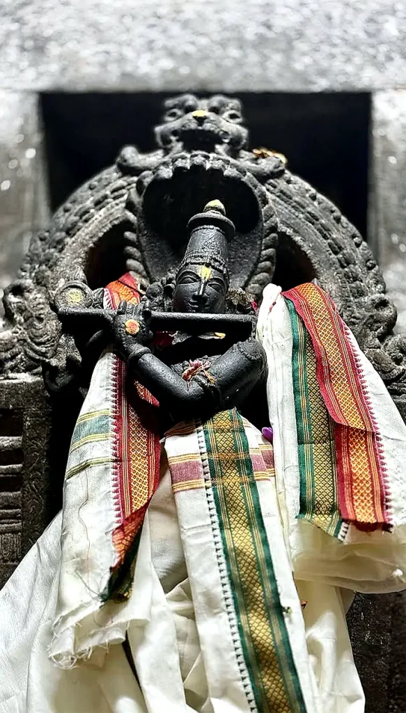 Black stone Venugopala Krishna playing flute silk angavastram Nainamalai Temple