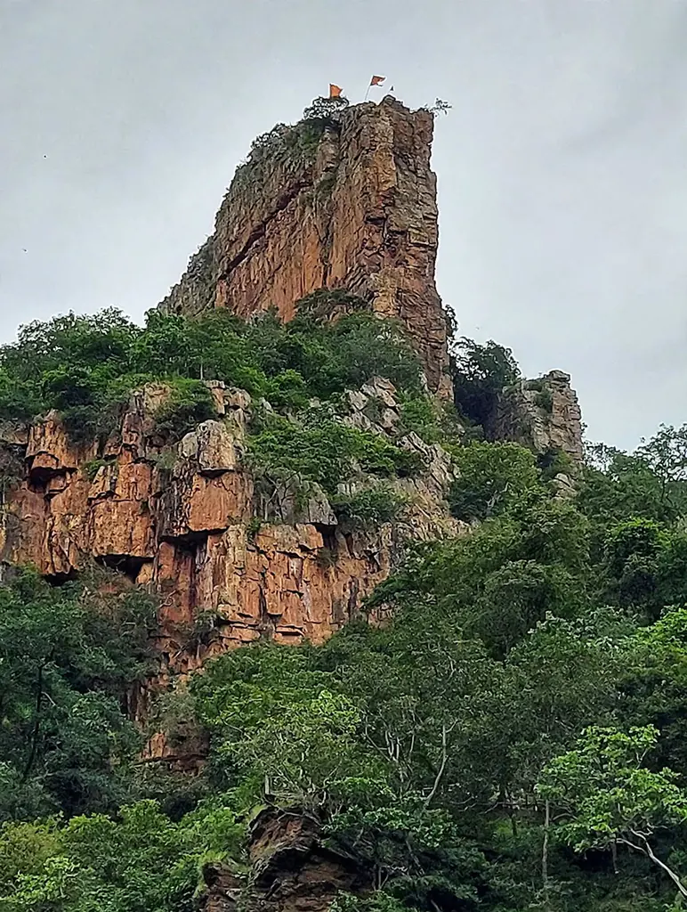 Natural rocky cavern entrance of Upper Ahobilam Narasimha temple surrounded by dense forest